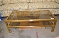 MID CENTURY BRASS AND GLASS COFFEE TABLE; 43"