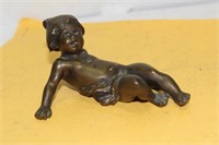 A Signed Solid Bronze Baby Figure