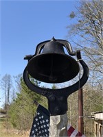 Cast iron bell with tree pole