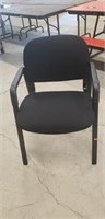 Black metal padded chair  with arm rests