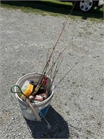 Bucket of mini fishing poles and fishing supplies