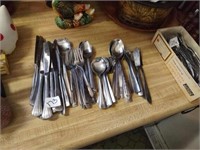 Assorted flatware. Will need to be cleaned.