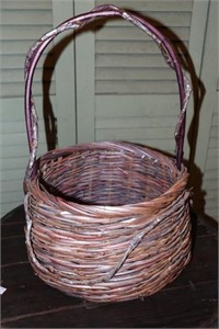 Basket with vine/root handle 21" tall