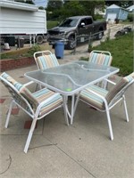 PATIO TABLE AND 4 CUSHIONED CHAIRS