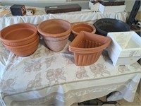 Clay and plastic planter pots