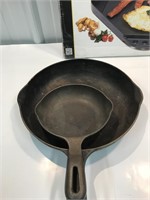 Cast iron fry pans and barbecue griddle.