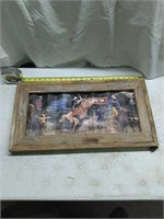 Painted tin rodeo sign in barnwood frame