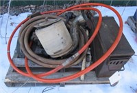 Pallet of parts including hose, large pulley,