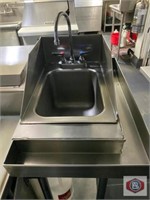 Hand sink with drainboard. Side splash guards.