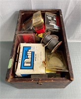 Old wooden box full of miscellaneous hard