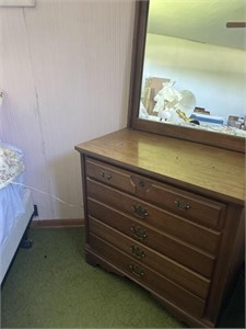 a dresser with mirror