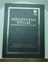 Presidential dollar collector coins in folder