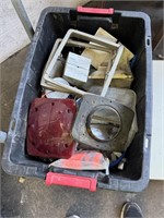 Box of trailer lights, connectors, and plates