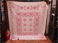 Handstitched quilt with cross stitch flower