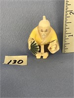Colorful carved ivory netsuke, of a oriental man h