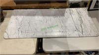 Large piece of white marble with gray striations.