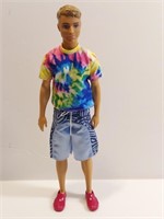 Young Blonde Ken Doll In Sequined Tie-dye And