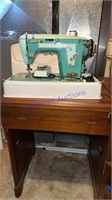 Vintage White sewing machine, cabinet with