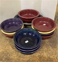 13 pieces of Fiesta Ware - two platter plates, one