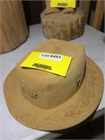 Hat carved from wood