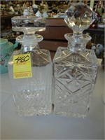 Two heavy cut crystal decanters with stoppers,