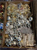 Box of gold and silver christmas ornaments