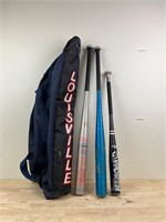 baseball lot -bats with Louisville sports bag