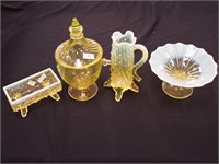 Four pieces of yellow glass, three