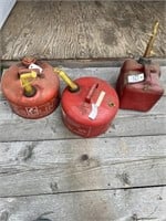 2 Metal 2 1/2 Gal Gas Cans, and 1 Plastic Gas Can