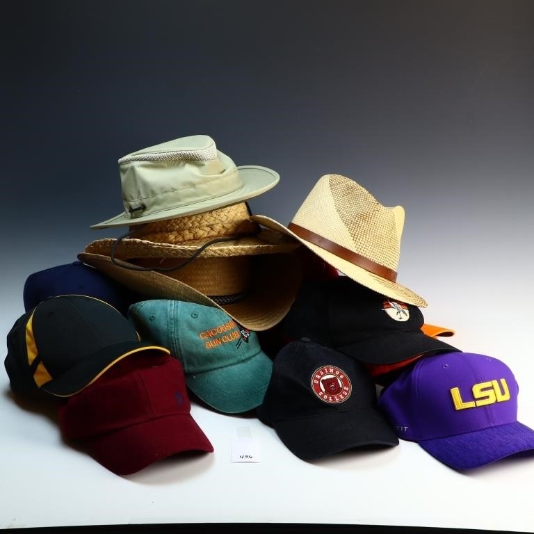 Lot of straw hats and baseball caps