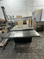 Stainless steel kitchen work table with overhead