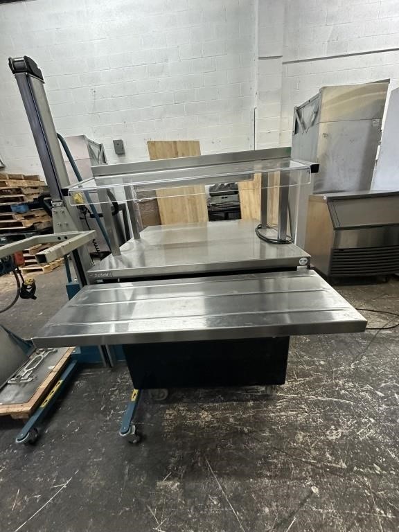 Stainless steel kitchen work table with overhead