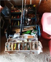 Fishing poles and tackle box with contents.