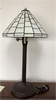 Leaded glass lamp on metal ribbed design base, 24