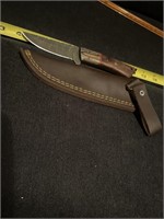 Damascus steel knife with sheath.