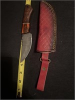 Damascus steel knife with red leather case