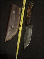 Damascus steel knife with sheath.