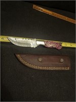 Damascus steel knife with sheath.