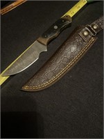 Damascus steel knife with sheath.