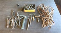 Extension cord, bolts, caulk gun, wrenches,