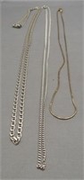 Three sterling silver necklaces of various