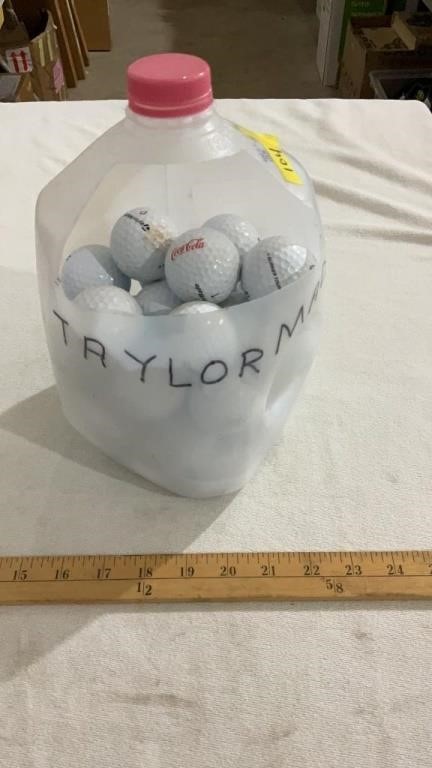 Milk jug full of golf balls