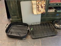 LOT OF ROASTING PANS/ CUTTING BOARD/ MORE