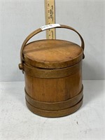 Primitive covered wooden bucket