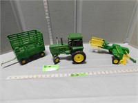 Toy John Deere tractor, kick baler and hay wagon