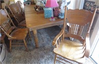 Table w/several leaves and 3 pressed back chairs