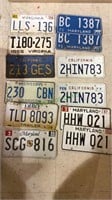 12 vintage car license plates, includes