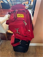 2 luggage and red bag