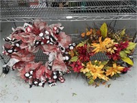 Lot of 2 large wreaths. 1 has red black and white