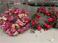 A lot of two large wreaths. 1 has pink and green
